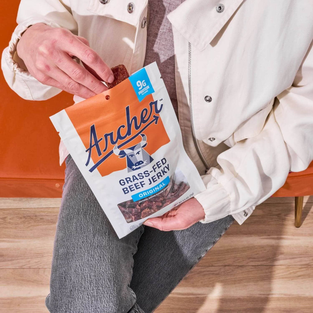 Person eating Archer Grass Fed Beef Jerky